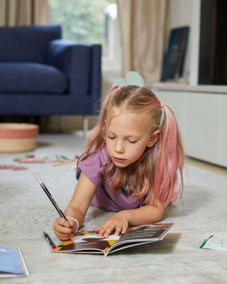 Girl drawing in Maasai Wipalabox Magazine